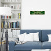 A vintage metal sign on a white wall reads Take time to do what makes your soul happy above a blue sofa.
