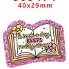 Pink glitter acrylic charms shaped like an open book with flowers for DIY crafts and hairbows