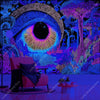 A vibrant psychedelic tapestry featuring glowing geometric patterns and an eye motif in purple, blue, and neon colors.