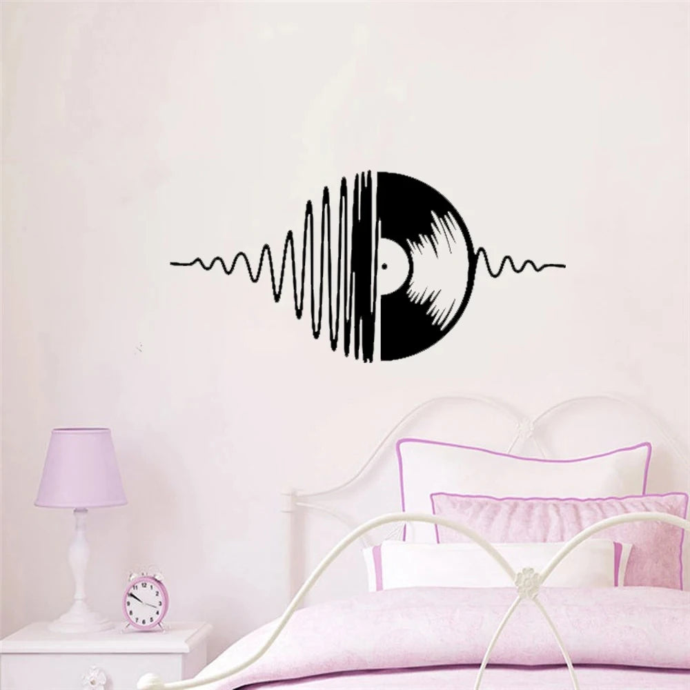 Black vinyl decal of a sound wave graphic on a white wall above a bed
