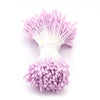 A cluster of pink artificial flower stamens used for DIY decoration.