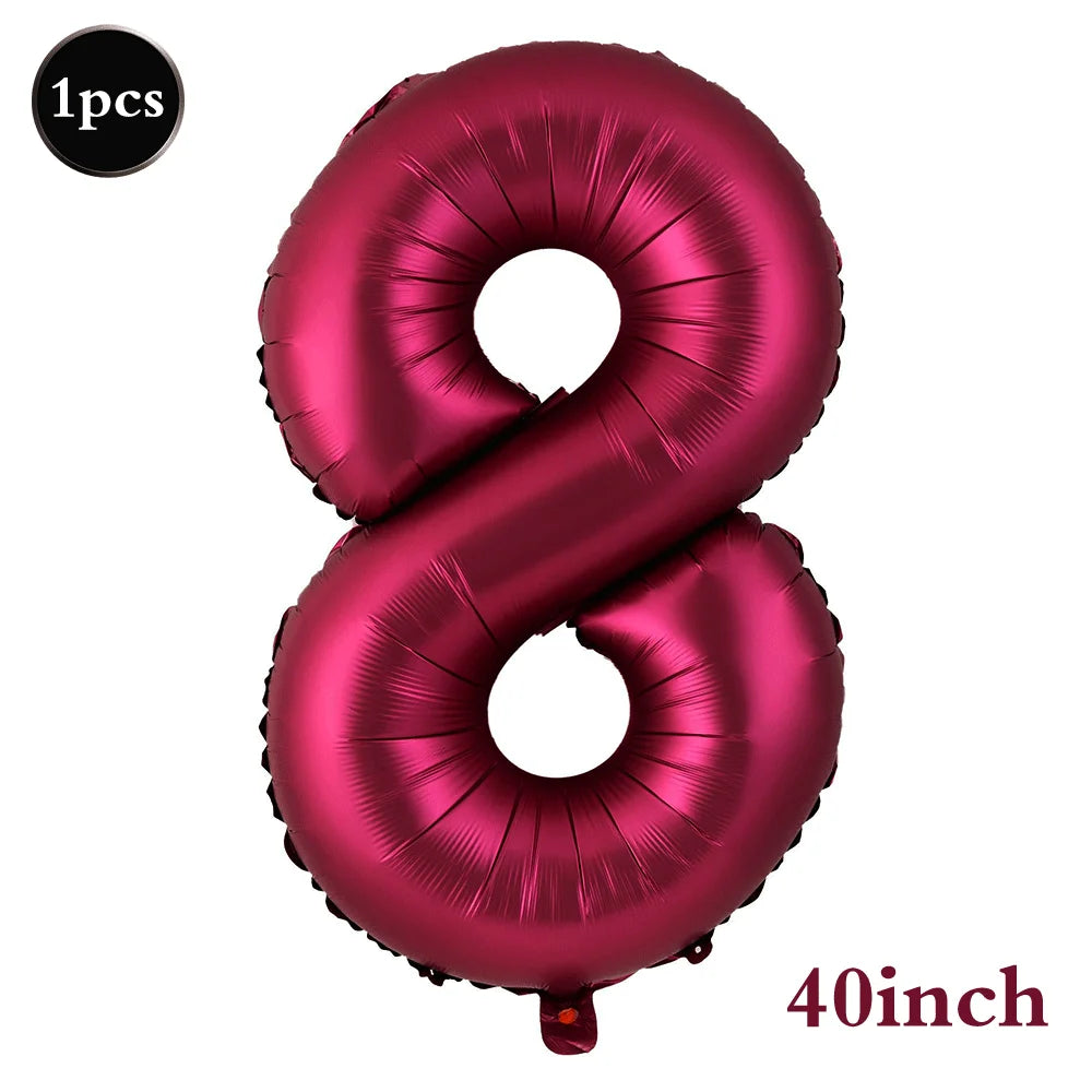 A large, metallic pink foil number balloon shaped like the number 8 for birthday and party decor.