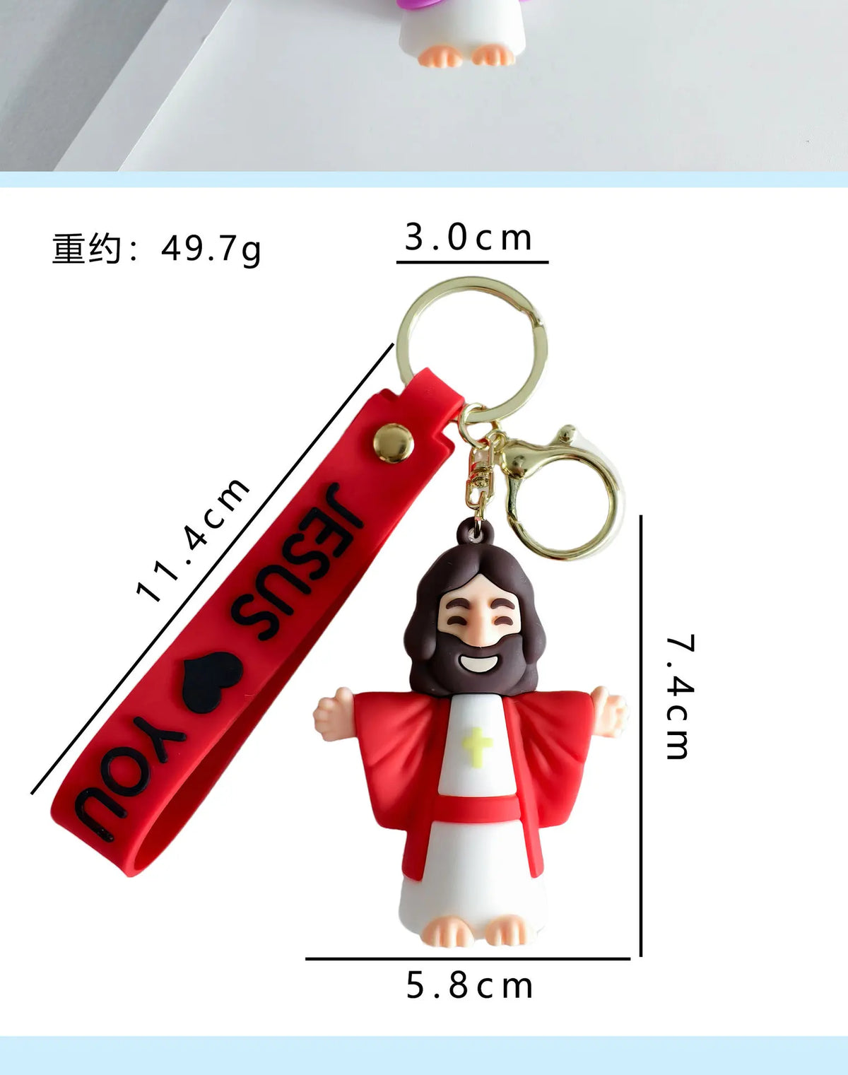 A red silicone keychain featuring a Jesus figure attached to a loop and a strap.