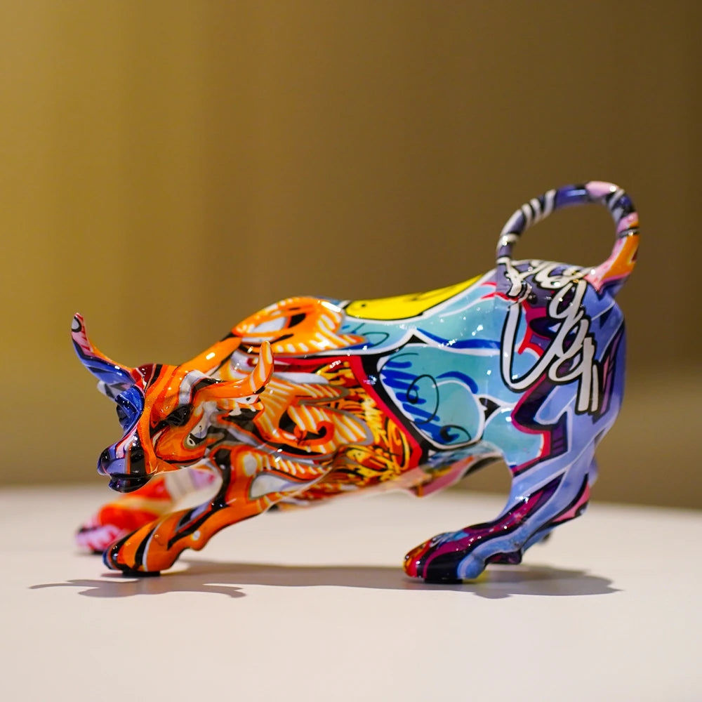 A colorful, stylized animal sculpture with horns and a curved handle, displayed on a white surface.