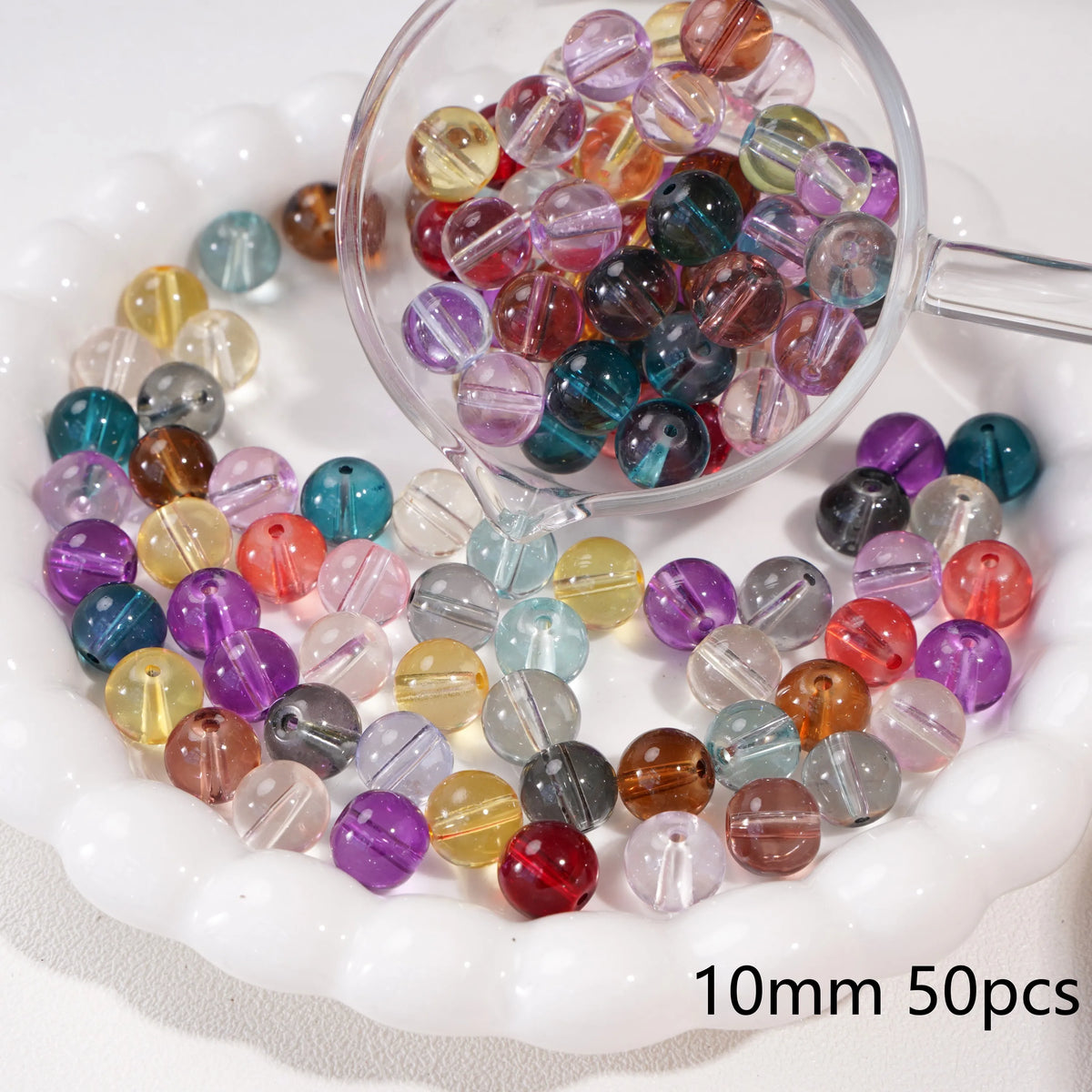 A clear glass bowl filled with colorful round spacer beads for jewelry making