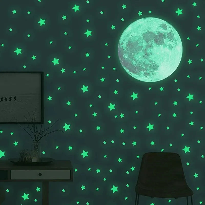A dark green wall decorated with glowing neon green stars and a large luminous moon.
