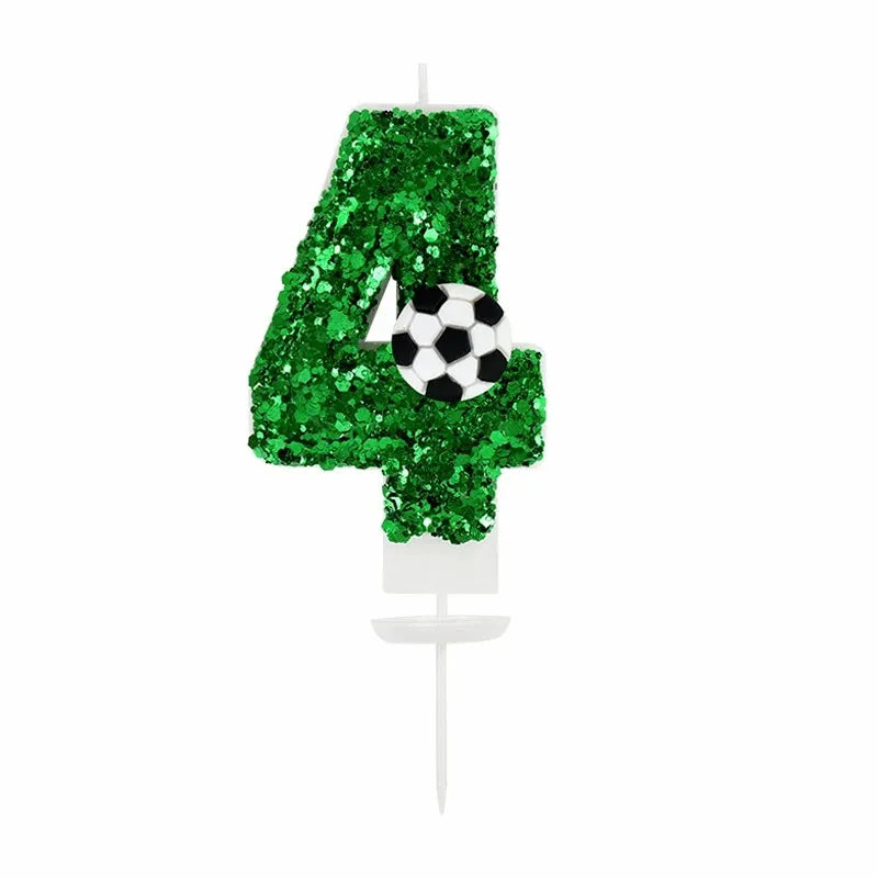 Green glitter number 4 candle decorated with a soccer ball design for a birthday theme