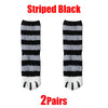 A pair of striped black and gray cat paw print plush socks.