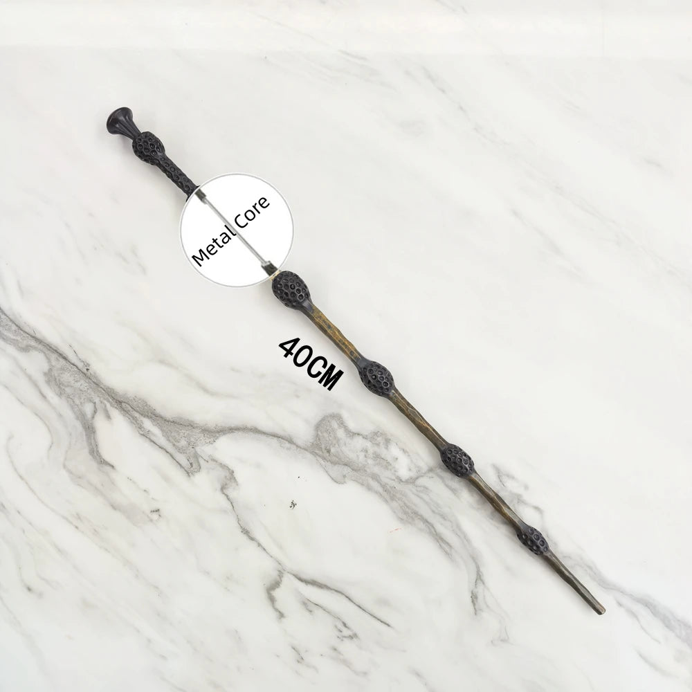 A long metal wand replica with a decorative head and 40cm length displayed on a white marble surface.