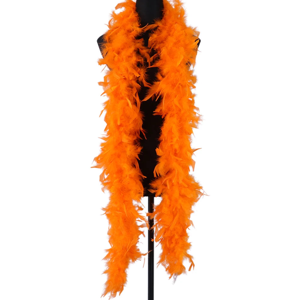 A bright orange natural turkey feather boa displayed on a black hanger.
