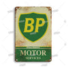 Vintage metal sign with a green shield featuring the letters BP and the text APPROVED MOTOR SERVICES