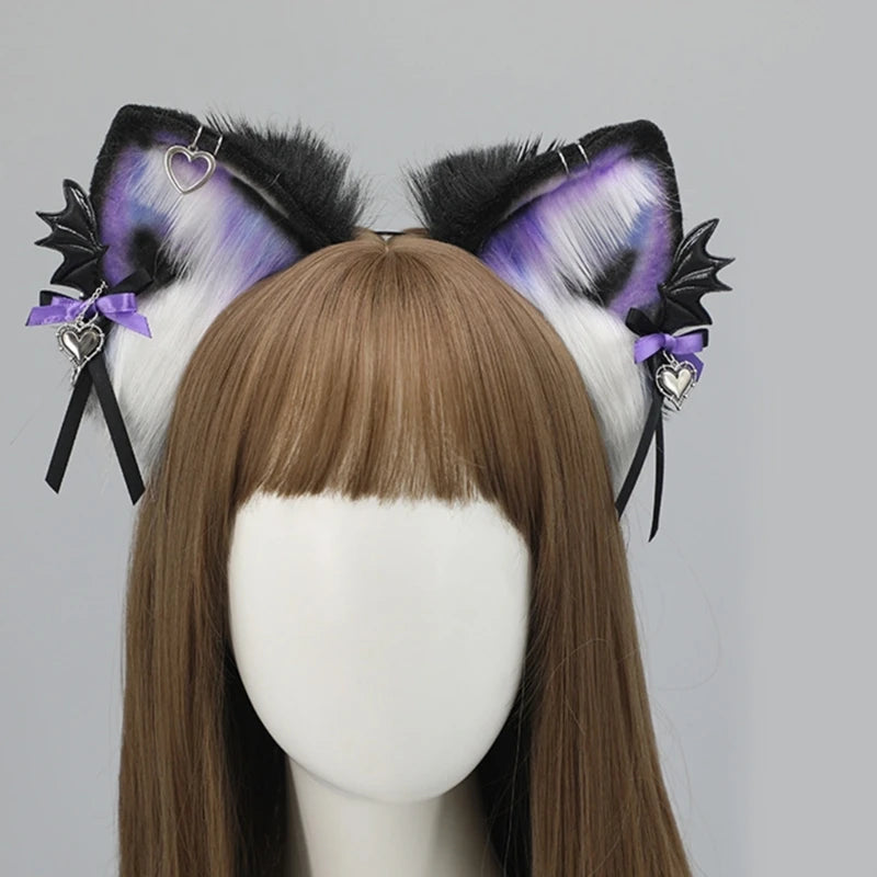 A pair of black and purple furry fox ears headband with heart accents displayed on a mannequin head.