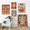 A set of three canvas art prints featuring deities including Ganesha, Shiva, and Parvati in vibrant colors.