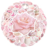 A circular arrangement of cute pink graffiti stickers for accessories, featuring floral and whimsical designs.