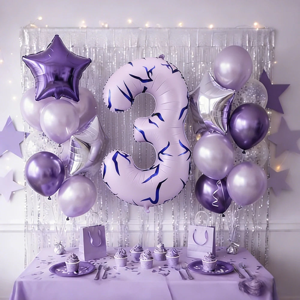 Purple and silver balloons forming the number 3 decorated with glitter and stars for a party theme