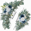 A floral kit featuring dusty rose and blue roses and eucalyptus greenery arranged in a wreath style.
