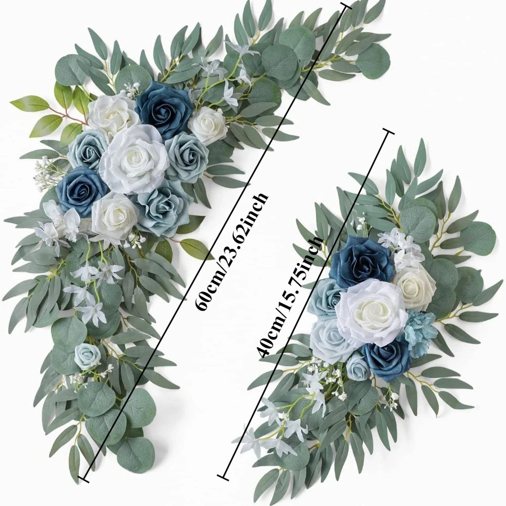 A floral kit featuring dusty rose and blue roses and eucalyptus greenery arranged in a wreath style.