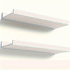 A set of two white rustic floating wood shelves mounted on a wall.