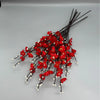 A cluster of artificial red plum blossoms on thin black branches.