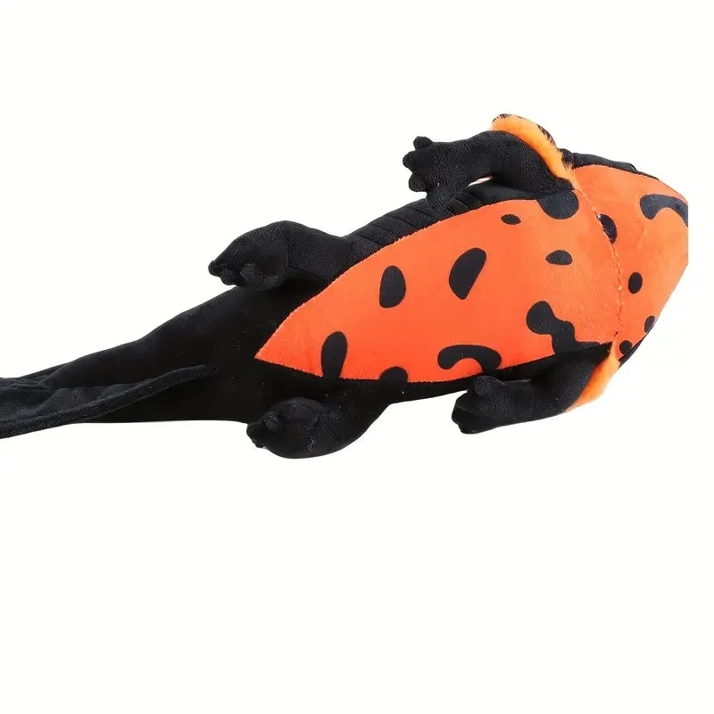 An orange and black axolotl plush toy with soft, textured skin.
