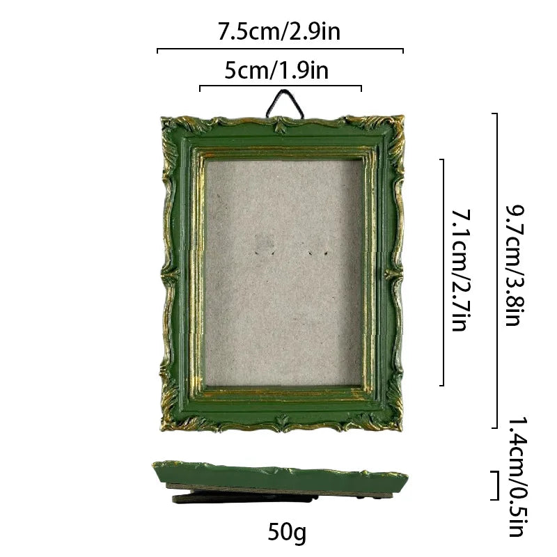 A rectangular vintage baroque resin picture frame with a green frame and light gray mat, shown with dimensions.