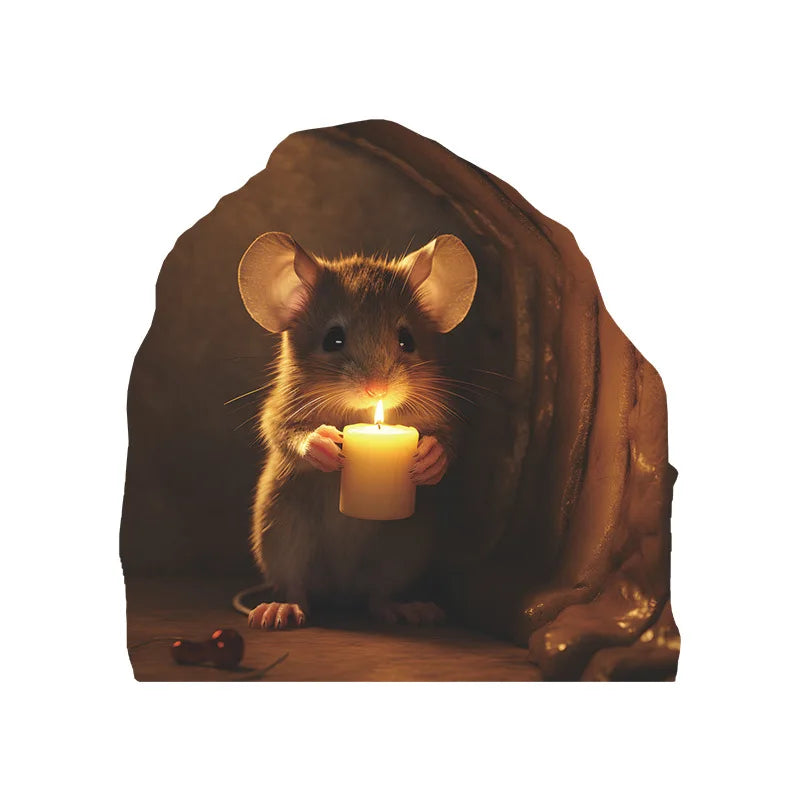 A small brown mouse with large ears holds a lit candle in a dark, draped background.