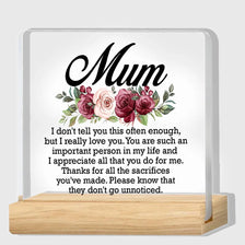 A personalized acrylic keepsake plaque with a wooden base featuring the text I don't tell you this often but I really love yo