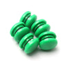 A set of ten bright green refrigerator magnets stacked in a row.