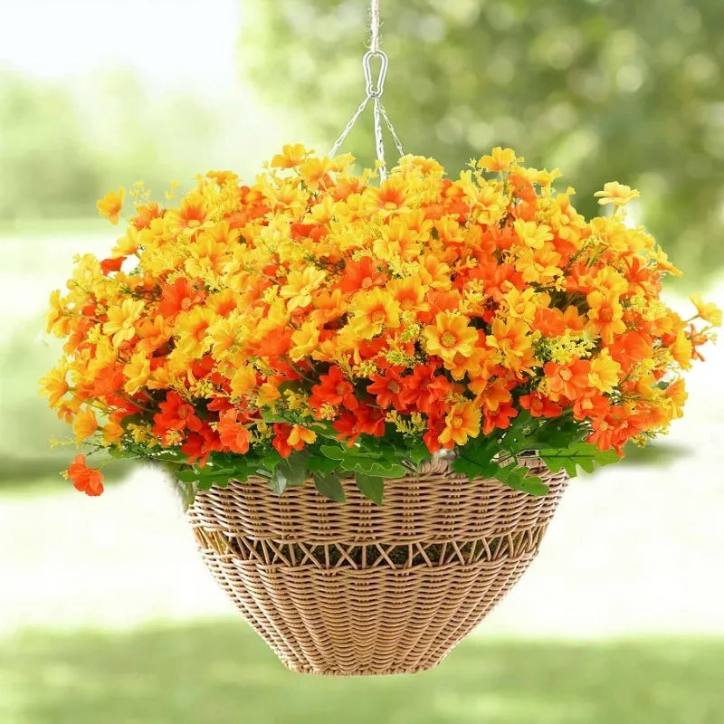 A basket filled with bright orange and yellow artificial daisy flowers, ready for indoor or outdoor decoration.