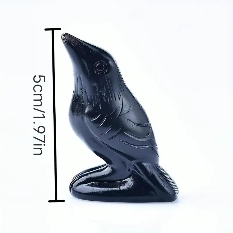 Black handcrafted obsidian crow statue with a long neck and stylized feathers.