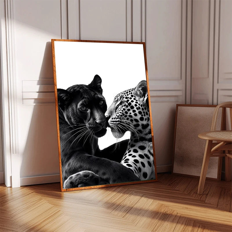A close-up painting of a black panther and a leopard touching noses on a canvas print.
