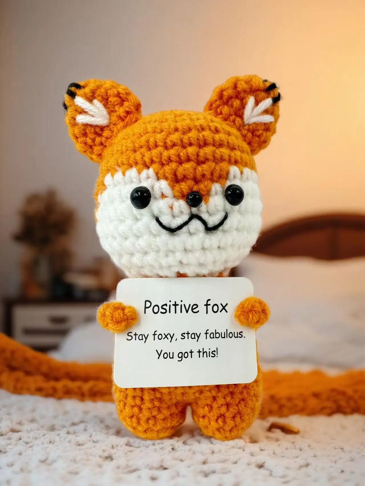 Handmade crochet fox doll with orange and white fur, holding a card that reads Positive fox stay foxy stay fabulous.