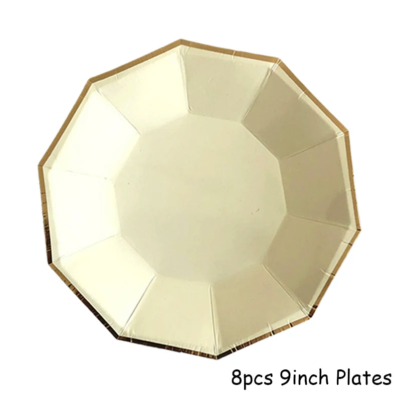 Eight 9-inch gold disposable plates arranged in a star pattern.