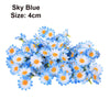 A cluster of blue and white artificial flowers, including daisies and sunflowers, used for DIY and wedding decor.
