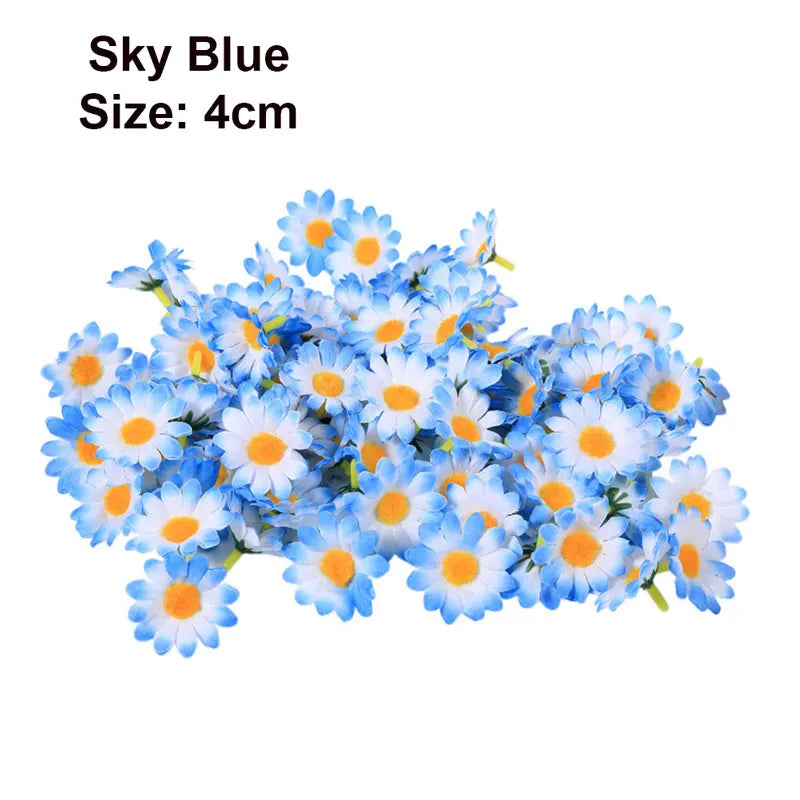 A cluster of blue and white artificial flowers, including daisies and sunflowers, used for DIY and wedding decor.
