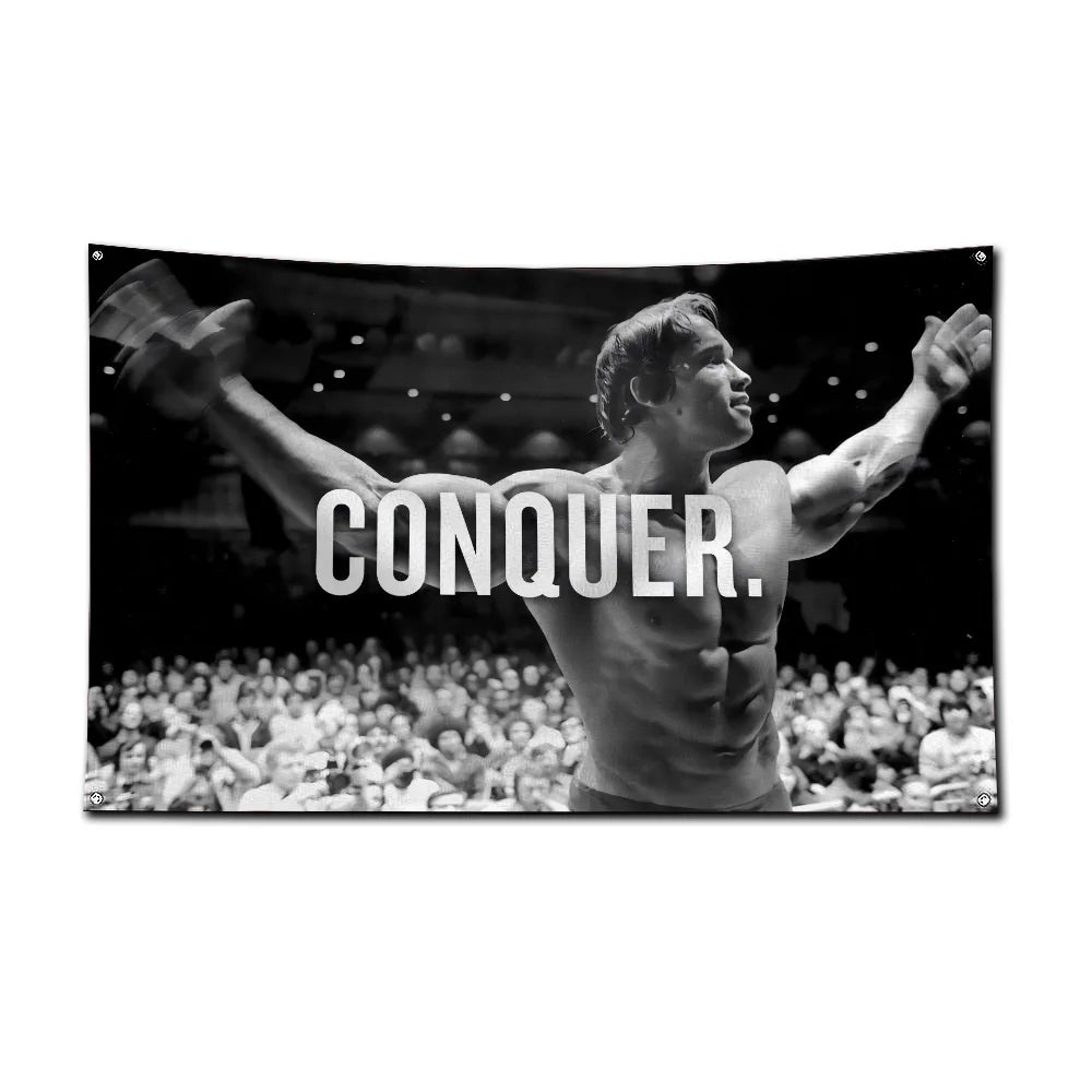 A black and white photo of a muscular man posing during a bodybuilding competition, with the word CONQUER visible.