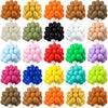 A collection of various colored latex balloons in clusters, including orange, yellow, green, black, white, and pink.