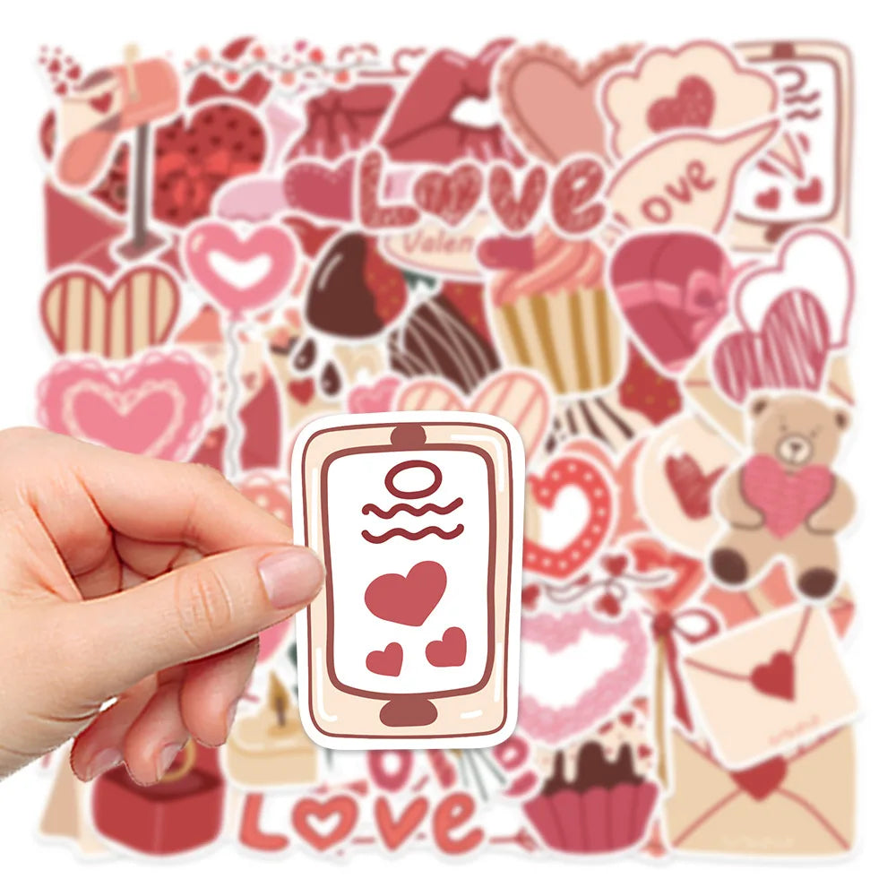 A hand holds a sheet of pink and red love-themed decorative stickers featuring hearts, guitars, and other symbols.