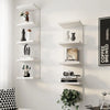 A white five-tier wall-mounted storage shelf displaying various decorative objects and plants.