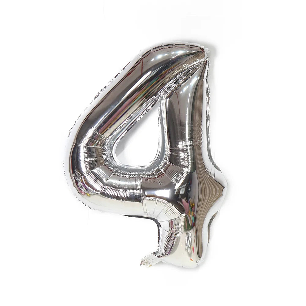 A metallic silver foil balloon shaped like the number 4.