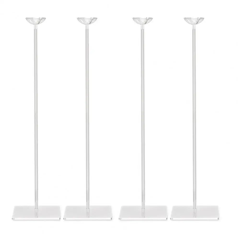 A set of four clear acrylic balloon stands with metal poles and bases.