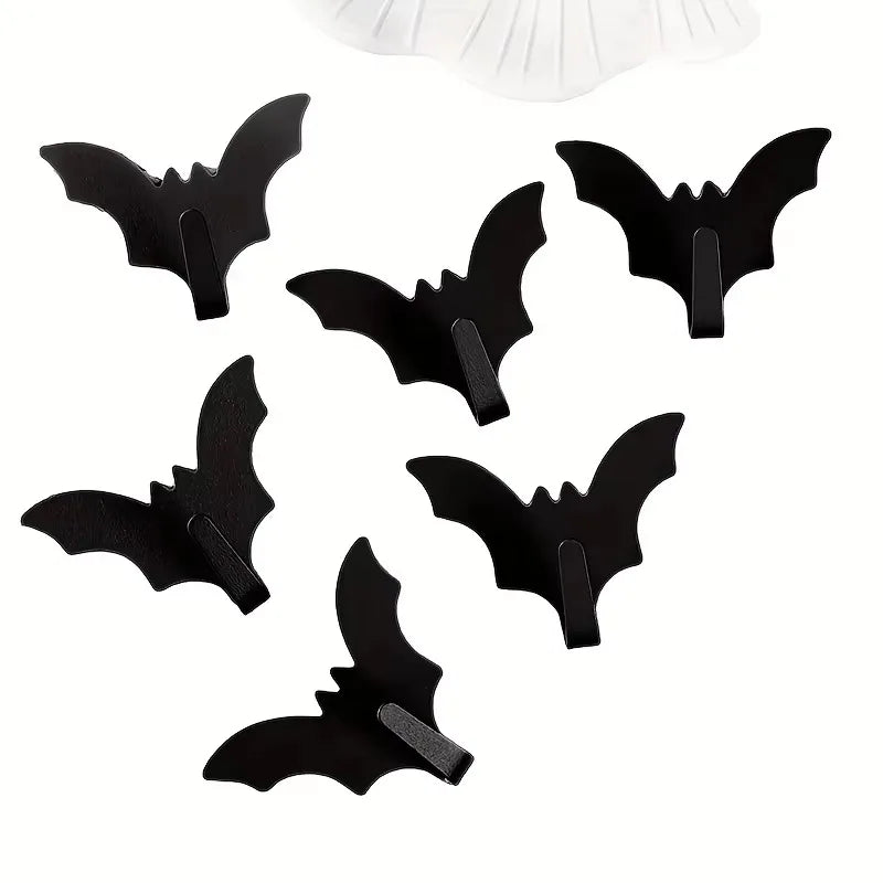 A set of five black gothic bat adhesive hooks for keys and bags.
