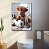 A painting of a brown Highland cow looking directly at the viewer, sitting next to toilet paper rolls.