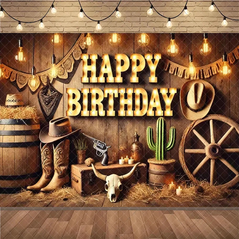 A rustic wild west cowboy birthday backdrop featuring a wooden barn scene with hay, leather boots, and a wooden wagon wheel.