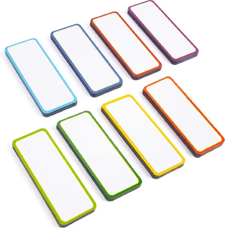 A collection of reusable magnetic dry erase labels and stickers in various colors and shapes.