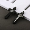 A set of black wooden crucifix pendants featuring the image of Jesus Christ.