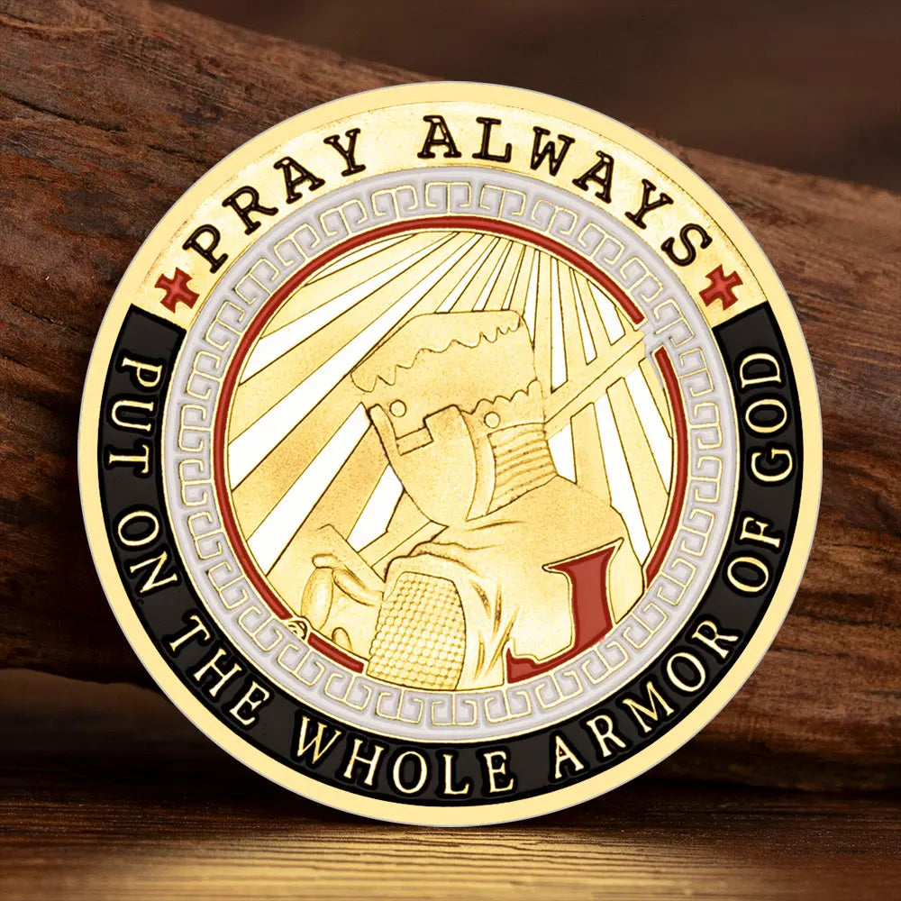 A round commemorative coin with text Pray Always Put On The Whole Armor Of God featuring a stylized helmet and rays of light.