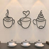 A trio of black metal wall art depicting steaming teacups against a white wall.