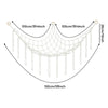 A beige cotton corner toy hammock for stuffed animals and plushies with hanging strands.