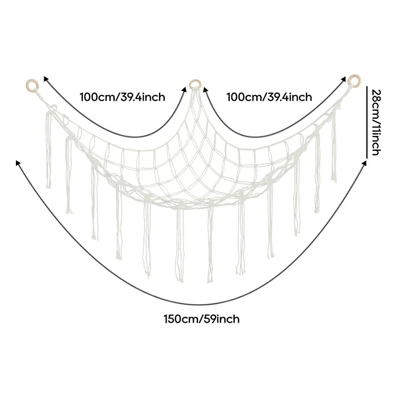 A beige cotton corner toy hammock for stuffed animals and plushies with hanging strands.
